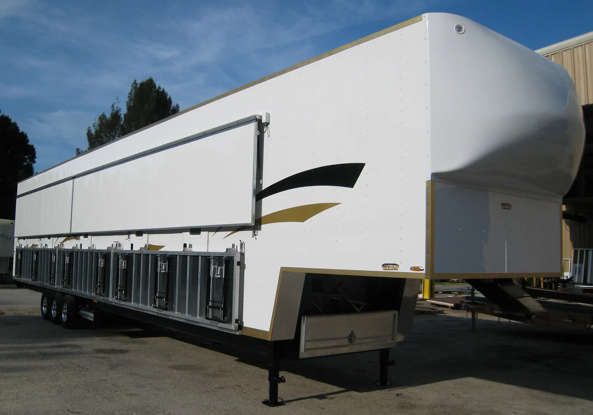 Lifetime fifth-wheel bunkhouse with exterior storage compartments